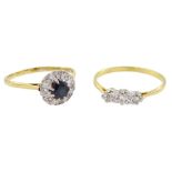 18ct gold sapphire and diamond cluster ring and an 18ct gold diamond three stone ring