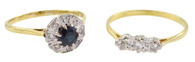 18ct gold sapphire and diamond cluster ring and an 18ct gold diamond three stone ring