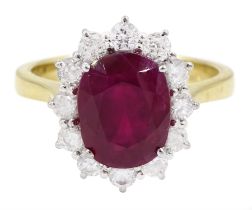 18ct gold oval cut ruby and round brilliant cut diamond cluster ring