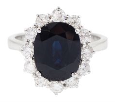 18ct white gold oval sapphire and round brilliant cut diamond cluster ring