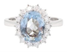 18ct white gold oval cut aquamarine and round brilliant cut diamond cluster ring