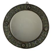 Eastern bronze and enamel mirror decorated in relief with trailing foliage and four applied roundels