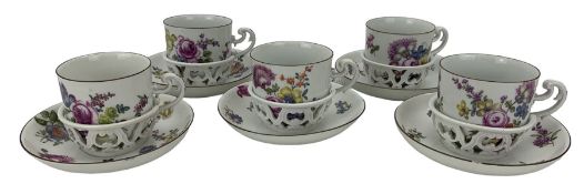 Set of five 18th century Meissen trembleuse cups and saucers