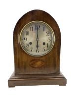 20th century 8day striking mantle clock in an oak veneered case.