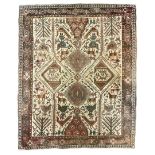 Antique Iranian ivory ground rug