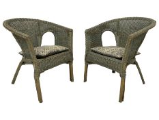 Pair of wicker armchairs in green finish with seat cushions