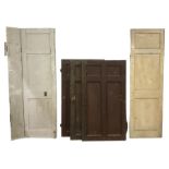 Five various 19th century Country House painted wood panelled doors - three in brown painted finish