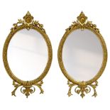 Pair of Victorian giltwood and gesso framed oval wall mirrors