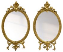 Pair of Victorian giltwood and gesso framed oval wall mirrors