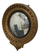 Regency giltwood and gesso framed circular convex wall mirror