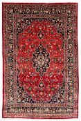 Persian Kashan crimson ground carpet