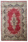 Persian Kerman red ground rug