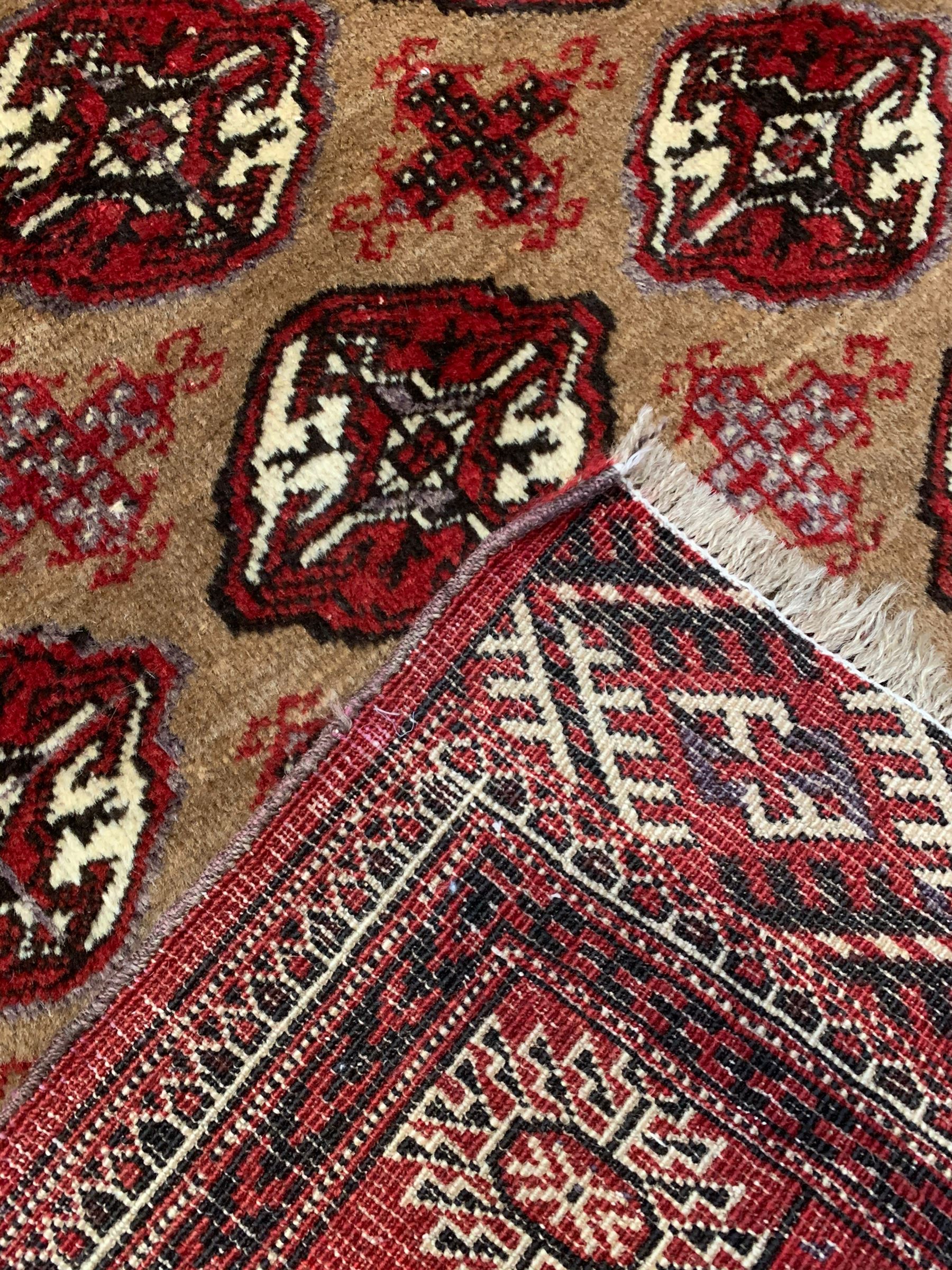 Persian Bokhara red ground rug - Image 6 of 6