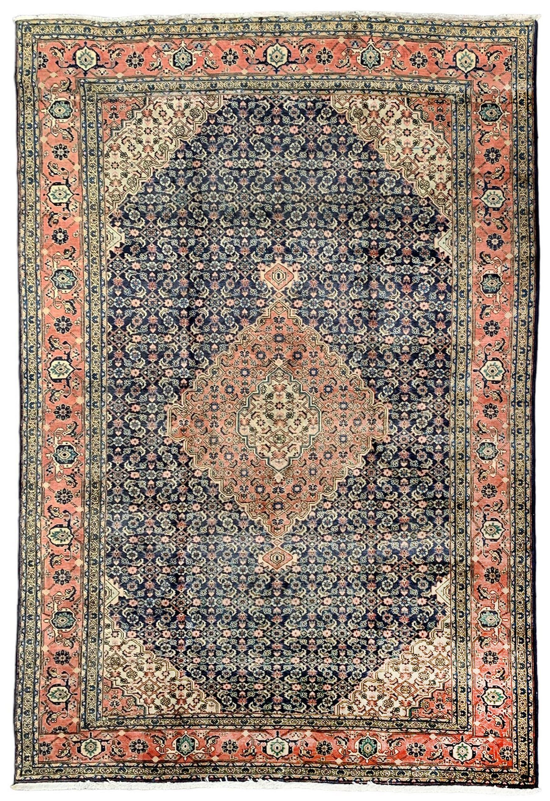 Persian pale indigo and peach ground rug