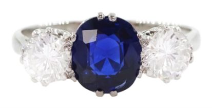 Platinum three stone oval cut sapphire and round brilliant cut diamond ring