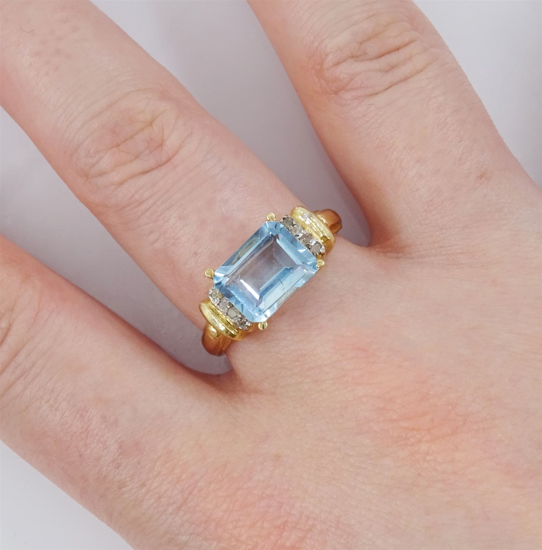 Gold emerald cut blue topaz and diamond ring - Image 2 of 4