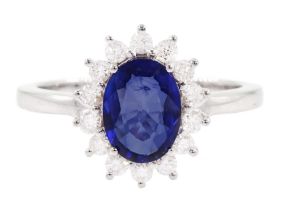 18ct white gold oval sapphire and round brilliant cut diamond cluster ring