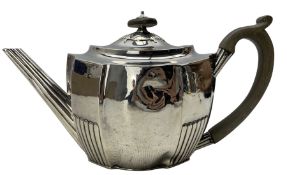 George III silver oval teapot of panel sided design