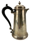 Silver hot water jug of tapering form with domed cover and ebonised handle London 1912 Maker Martin