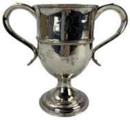 George III silver cup with capped scroll handles and engraved with a monogram on a pedestal foot H16