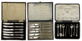 Two sets of six silver handled tea knives and a set of five silver teaspoons and tongs