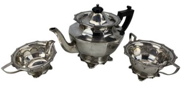 Edwardian silver three piece tea set of panel sided circular form