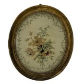 Victorian embroidered silk oval panel decorated with flowers within a trailing leaf border