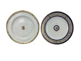 Two Armorial porcelain plates comprising a Davenport plain ground plate centrally painted with the B