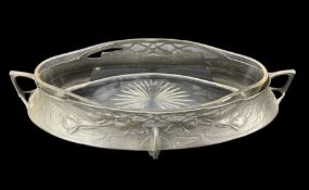 Art Nouveau pewter pointed oval fruit bowl with a raised pattern of trailing flowers beneath a pierc