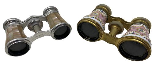 Pair of early 20th century French opera glasses painted with jewelled reserves of flowers on a pink