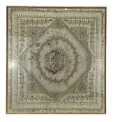 19th century Indian silk panel of geometric designwithin a floral border with silver thread
