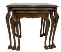 Mid-20th century nest of three walnut occasional tables
