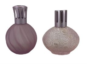 Two Lampe Berger pink glass fragrance lamps