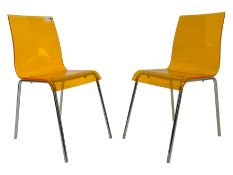 Pair of contemporary orange acrylic and polished metal dining chairs