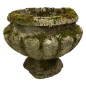 Weathered cast stone garden urn planter