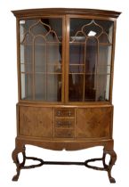 Early 20th century inlaid walnut bow-front display cabinet