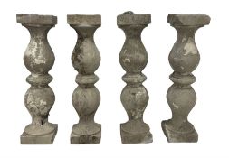 Set of four cast stone balustrade balusters