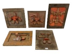 Four cast metal and wood industrial engineering casting moulds or foundry forms