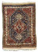 Antique Persian Quashqai maroon ground rug