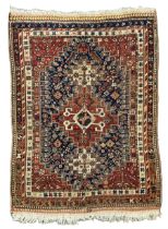 Antique Persian Quashqai maroon ground rug