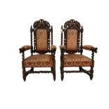 Pair of Victorian Jacobean Revival heavily carved oak armchairs