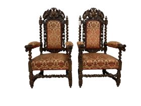 Pair of Victorian Jacobean Revival heavily carved oak armchairs