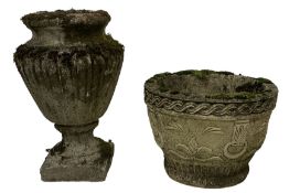 Weathered cast stone garden urn
