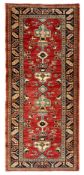 Persian design red ground rug