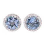 Pair of silver blue topaz stud earrings