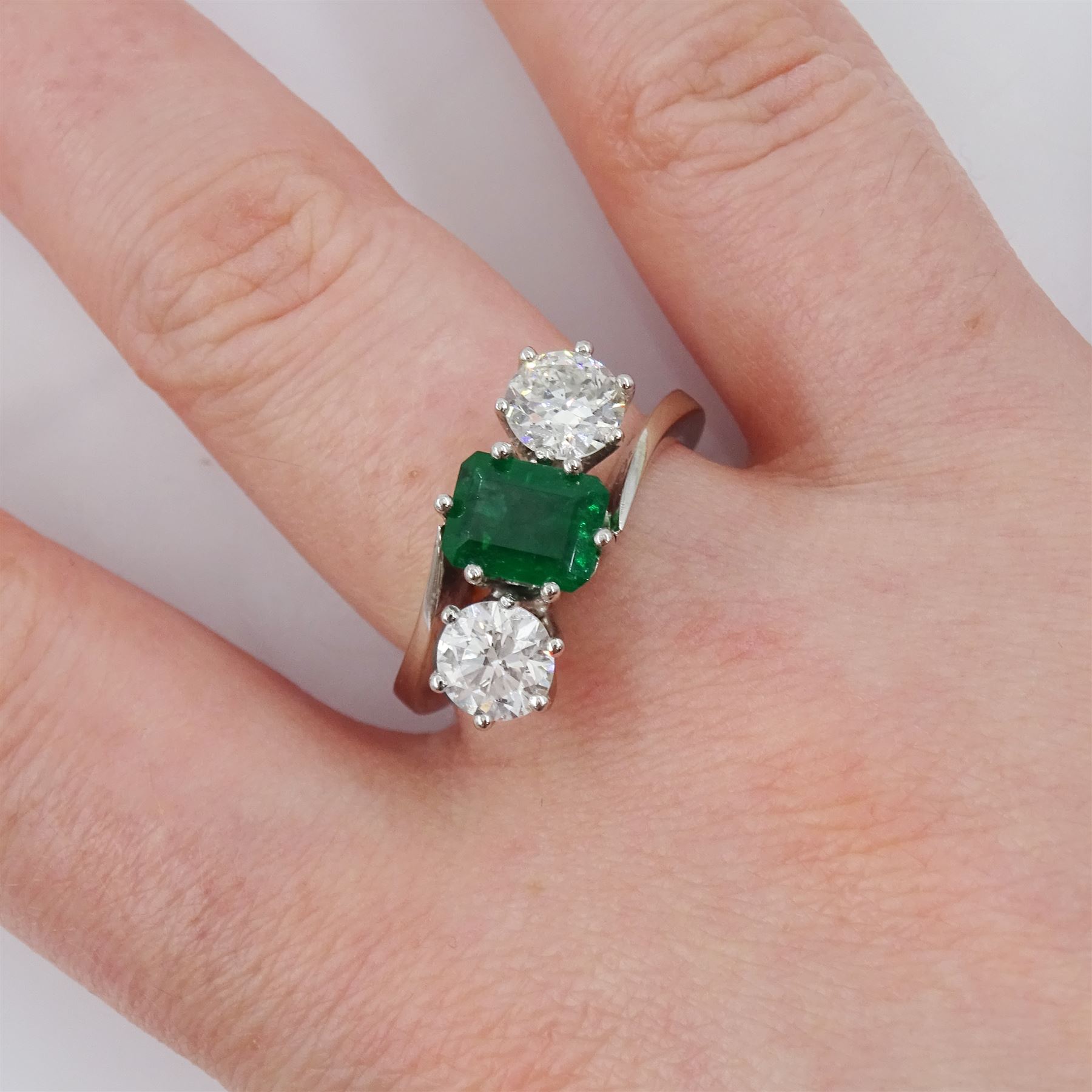 18ct white gold three stone octagonal cut emerald and round cut diamond crossover ring - Image 2 of 4