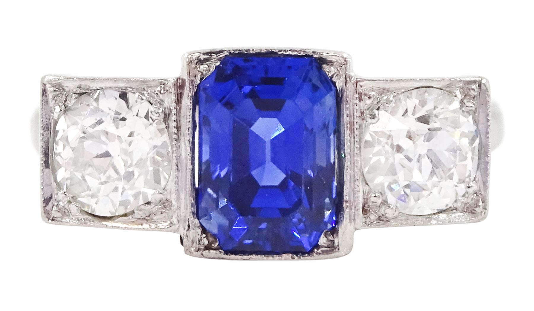 Platinum milgrain set three stone octagonal cut sapphire and old cut diamond ring