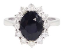 18ct white gold oval cut sapphire and round brilliant cut diamond cluster ring