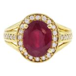 18ct gold oval cut ruby and round brilliant cut diamond cluster ring