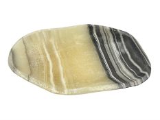 Free form dish made from carved and polished zebra onyx